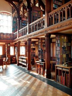 the inside of a library with many bookshelves