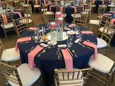 the tables are set with blue and pink linens