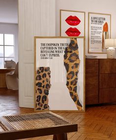 a room with posters on the wall and a table in front of it that has a leopard print