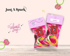 two bags of just a spark valentine's day candy sitting on top of a table