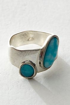 Add a statement detail to your hand with this abstract stone inlay ring. **Features:** Thick band, two round stone inlays**Why We <3 It:** Wear solo for a delicate look or layer with others for a maximalist moment. Chunky Turquoise Ring, Blue Stone Jewelry, Chunky Gem Rings, Tarnish Free Rings, Modern Turquoise Jewelry, Rings Rocks, Funky Jewelry Rings, Cool Silver Rings, Big Silver Rings