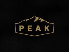 a black and gold logo with the word peak on it's left hand side