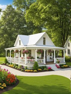 a white house surrounded by flowers and trees