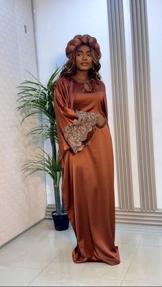 Indulge in elegance with our Luxury Silk Bubu in Brown. Crafted with the finest silk, this stunning gown features intricate lace detailing and a unique cutout. Luxury Brown Dress For Eid, Eid Party Silk Abaya, Luxury Brown Long Maxi Dress, Luxury Brown Satin Dress, Luxury Elegant Brown Abaya, Stunning Gowns, Luxury Silk, Muslim Fashion, Lace Detail