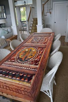 a dining room table that has been decorated with an intricately designed design on it