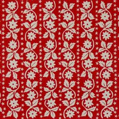 red and white fabric with small flowers on the front, in an ornate pattern that is very