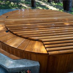 a wooden bench sitting in the middle of a park