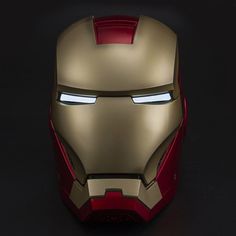 the iron man helmet is glowing in the dark