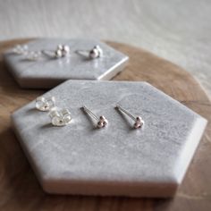 Teeny tiny little studs! Made from the tiniest recycled sterling silver pebbles.  And a more substantial medium-sized version for a more statement look.  Perfect for very day wear and cute as a button.  Made with love from my home workshop in Oxfordshire.  Although made to a high quality, each item in unique and may vary slightly from the item photographed.  If you would like to see the exact item I am sending you, please ask me to do so on the 'message' section on the order Wherever possible I Postal Packaging, Cardboard Jewellery, Cardboard Jewelry Boxes, Silver Gift Wrap, Cute As A Button, Recycled Silver, Silver Gifts, Recycled Sterling Silver, Earring Backs