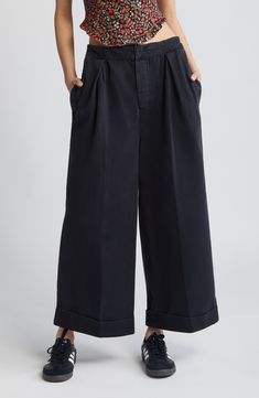 Casual-cool style is easy in these relaxed wide-leg pants featuring a comfy elasticized waist and rolled cuffs for polished detail. 24 1/2" inseam; 26" leg opening; 14" front rise; 17" back rise (size Medium) Zip fly with hook-and-bar closure Front slant pockets; back patch pocket 100% cotton Machine wash, tumble dry Imported Pants Nordstrom, Gaucho Pants, Fabric Gifts, Free Fabric, Black Fits, Leg Pants, Patch Pocket, Wide Leg Pants, Cool Style