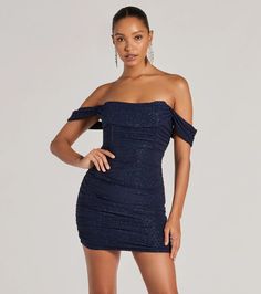 Get ready to glimmer in this gorgeous glitter knit mini dress featuring an off-the-shoulder neckline with a draped overlay and short sleeve cuffs, and a chic corset bodice for that snatched fit you love. The ruched side seams will accentuate your curves along the bodycon silhouette.   Fit & Features    Lined glitter knit fabric, plenty of stretch  Off-the-shoulder angled neckline  Draped overlay, short sleeve cuffs  Corset bodice, flexible boning  Ruched side seams  Mini-length bodycon fit  Runs true to size