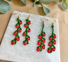 Handmade earrings 18k Gold plated Hooks Christmas earrings/ Holiday earrings / Poinsettia earrings ready to ship  Approx 2 inches long. Please message me if you would like a different length size. CARE TIPS AVOID SLEEPING, SHOWERING, OR DOING ANY WATER ACTIVITIES  WHEN JEWELRY IS NOT BEING WORN, PLEASE STORE IT IN A DRY COOL AREA TO PREVENT DAMAGE FROM THE ELEMENTS Poinsettia Earrings, Beaded Flower Earrings, Seed Bead Jewelry Patterns, Beaded Earrings Native, Holiday Earrings, Handmade Jewelry Tutorials, Beaded Earrings Patterns, Handmade Beaded Jewelry, Holiday Earring