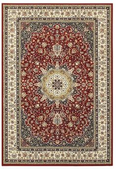 a red and black rug with an ornate design on the center, surrounded by smaller flowers