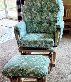 a rocking chair and footstool in front of a window