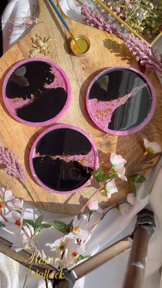 an artistically designed wooden tray with mirrors and flowers