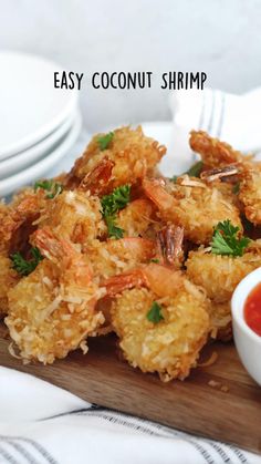 some fried food on a wooden board with sauce