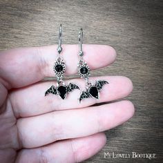 tiny and elegants earrings with black elegant blings and black enameled bats on the bottom. they're pretty lightweight and perfect also as a gift for your beloved ones. they're perfect also as a stocking filler, and a piece of a gift box, if you like.  you'll receive a pair of earrings, two bats. this piece is send with lovely gift bag. lead and nickel free. please note: this item is send with signed for mail and may require your signature. Do you want cheaper shipping, with no tracking? I can do it for you! just write me a convo and I'll set everythin, thank you. Gothic Sterling Silver Earrings For Gift, Vampire Earrings Gothic Jewelry, Gothic Stud Earrings, Gothic Nickel-free Earrings For Halloween, Victorian Bat Jewelry, Earrings Gothic, Bat Earrings, Gothic Accessories, Creatures Of The Night