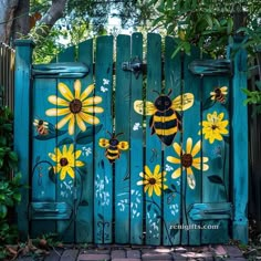 a painted fence with flowers and bees on it