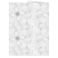 a white paper with an abstract flower design on the front and back side of it