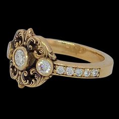 a gold ring with diamonds on it