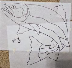 a drawing of a fish on paper with numbers 3 and 5 drawn in front of it