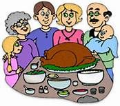 a family standing around a table with a turkey on it