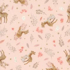 a pink fabric with deers and flowers on the side, in front of a light pink background