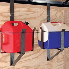 two red, white and blue containers hanging from hooks