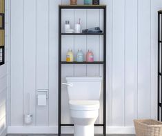 a white toilet sitting in a bathroom next to a shelf