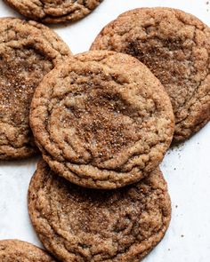 a pile of cookies sitting on top of a white table