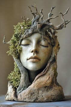 a woman's head with trees growing out of it and her face covered in moss