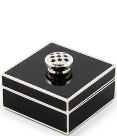 a black and white box with a metal knob