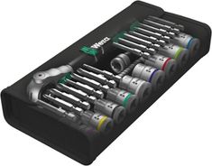 an open toolbox filled with various tools and wrenches on top of each other