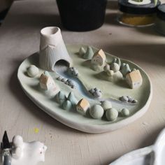 there is a small plate that has some rocks on it