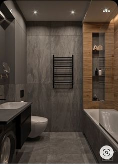 a bathroom with a toilet, sink and bathtub next to a wall mounted radiator