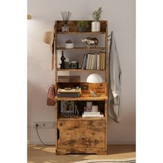 an old wooden shelf with books and other items