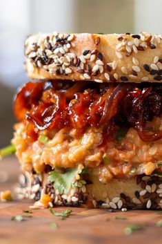 a close up of a sandwich with meat and sesame seeds