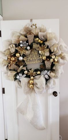 a christmas wreath hanging on the front door