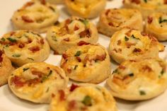 small appetizers are arranged on a white plate