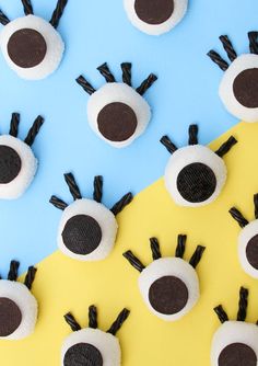 some black and white fake eyes on a yellow and blue background