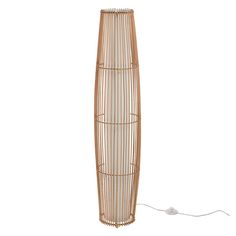 the floor lamp is made out of bamboo and has a white cord attached to it