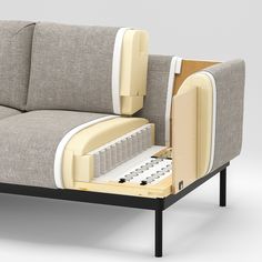 a couch that has its back open and is sitting on a table