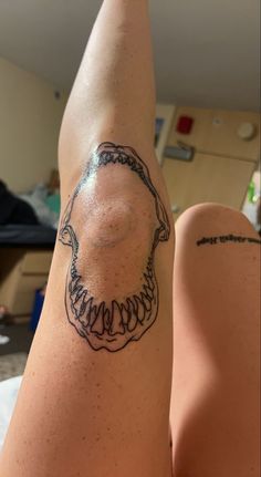 a person with a tattoo on their leg