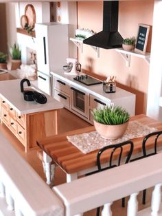 a doll house kitchen and dining area