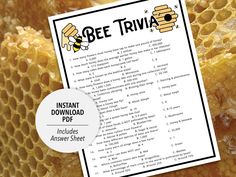 the bee trivia printable is displayed next to some honeycombs