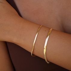 The Snake Chain Bracelet is an elevated, slinky and the perfect addition to you layered bracelet stack. • 18k Brazilian Gold Filled over Brass • Available in 4mm (7” inches in length) or 3mm (6.5” inches in length) • Hypoallergenic. Nickel & Lead Free. All of our jewelry comes in gift-ready packaging! Snake Chain Gold Bracelet, Gold Snake Chain Bracelet, Snake Gold Bracelet, Gold Snake Bracelet, Gold Prom Jewelry, Simple Gold Bracelet, Gold Jewelry Prom, Gold Bracelets Stacked, Gold Bracelet Simple