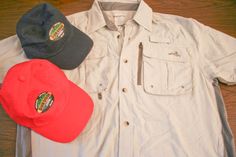 three hats are laid out on top of a white button up shirt and black hat