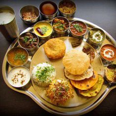 a platter filled with different types of food and condiments on top of it