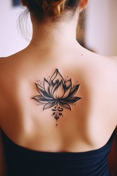 A woman's back with a black and white lotus flower tattoo. Lotus Cover Up Tattoo For Women, Small Feminine Back Tattoos, Interesting Tattoos For Women, Unique Lotus Flower Tattoo, Lotus Cover Up Tattoo, Lotus Tattoos For Women, Lotus Hand Tattoo, Tattoo Ideas For Women Unique, Purple Lotus Tattoo