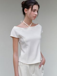 This is a minimal and feminine top by ourcomos that is made out of high quality and sturdy material. With distinctive mood of the design and comfortable wear, you can use it for your daily lifestyle.- Feminine boat neckline- Front strap that can be styled as halter neck- Modern and minimal mood Elegant Off-shoulder Top, Elegant Tops With Stretch And Wide Neckline, Elegant Stretch Tops With Wide Neckline, Elegant Stretch Top With Wide Neckline, Modern Blouse For Spring, Modern Solid Color Blouse For Spring, Versatile Off-shoulder Top For Spring, Elegant Evening Top With Wide Neckline, Chic Summer Off-shoulder Workwear Top